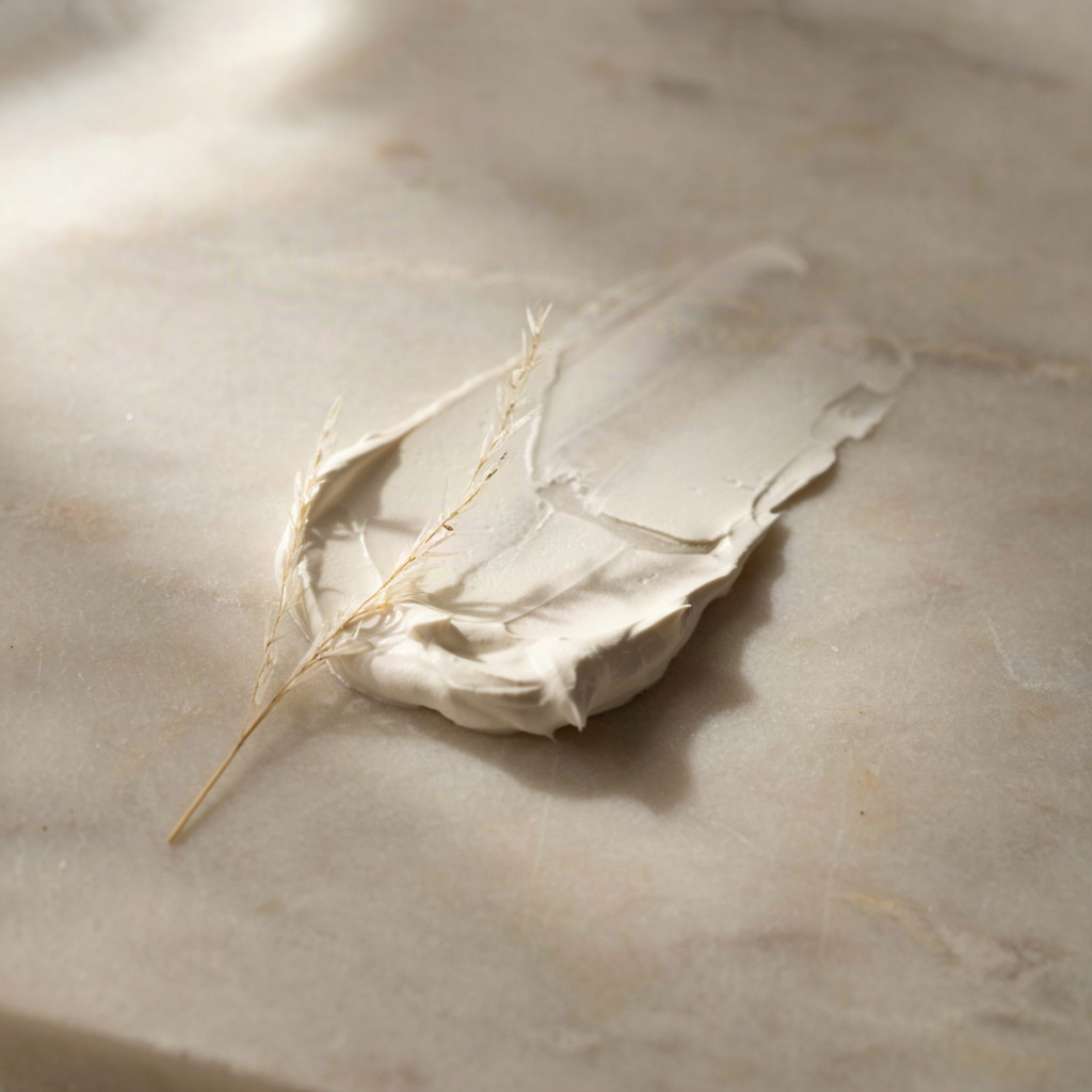 Thick white cream swatch showing the texture of a gentle sunscreen for sensitive skin
