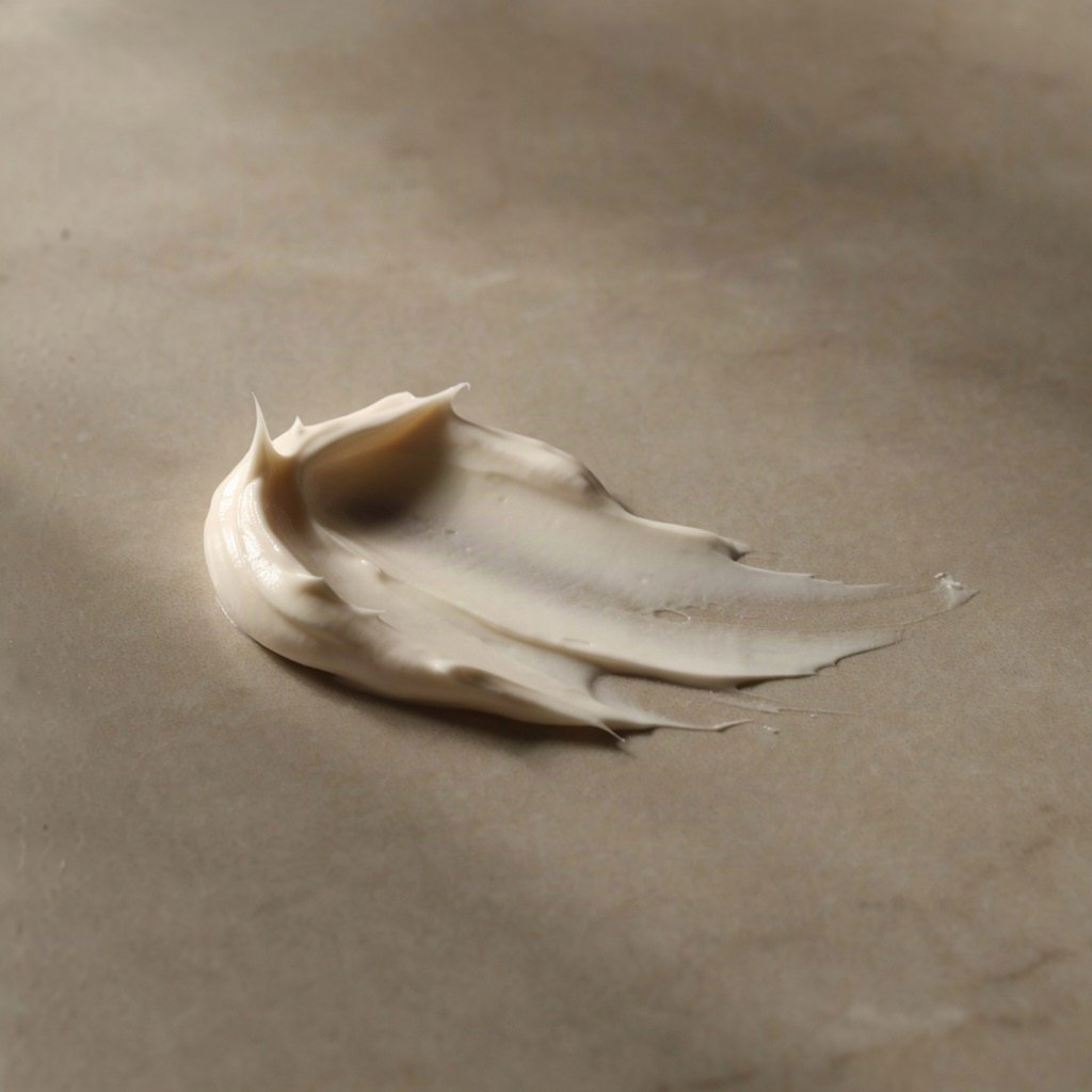 Macro close-up of a thick face cream for wrinkles swatched on a stone surface