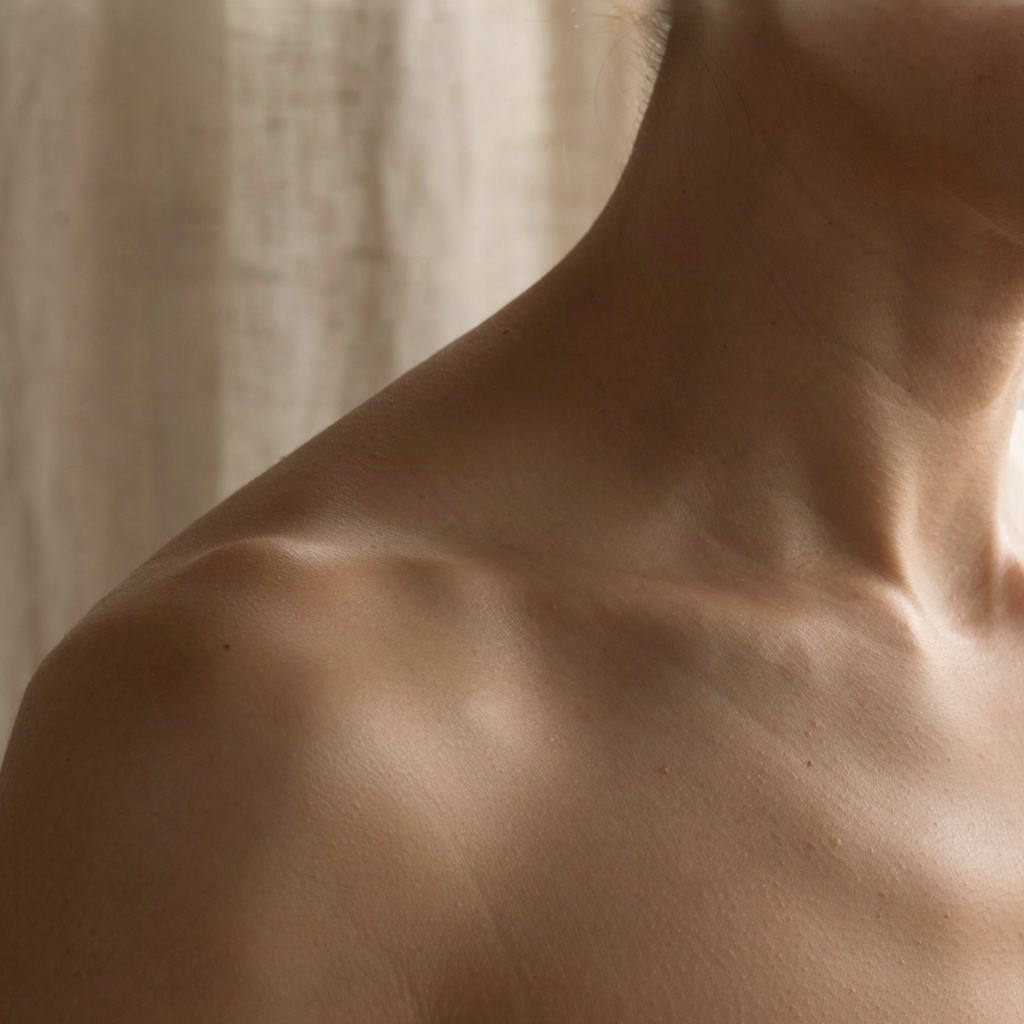 Close-up of neck and collarbone skin texture showing the fine horizontal lines a neck cream targets