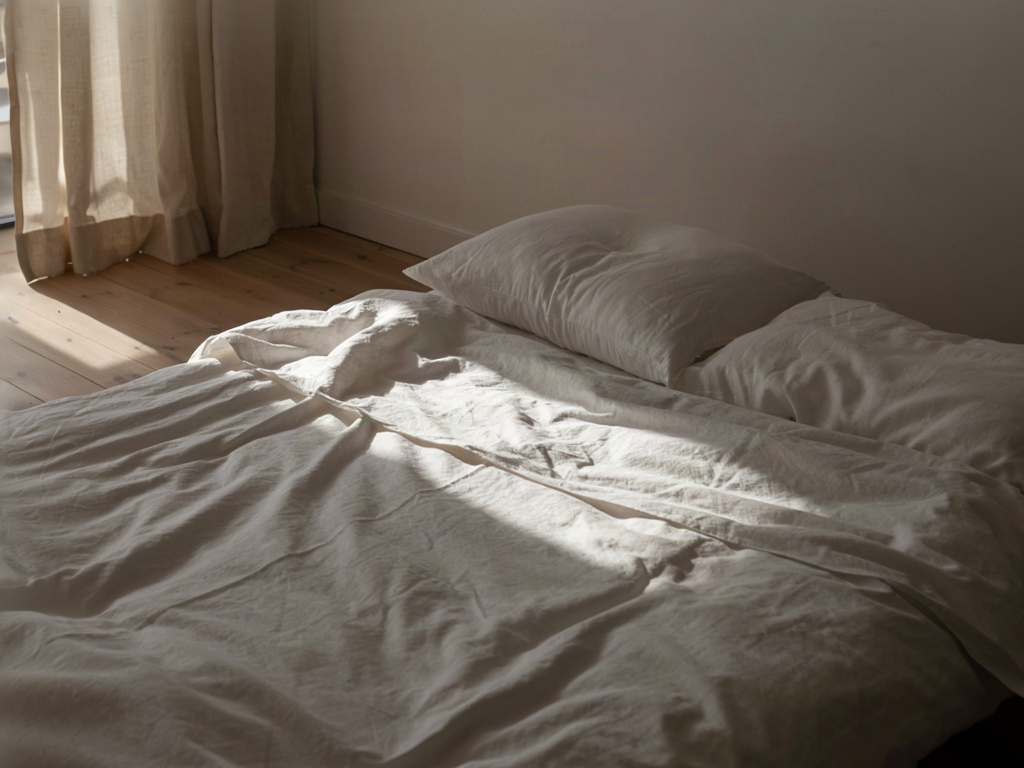 Bed with stacked pillows raised for how to remove bags under eyes naturally overnight